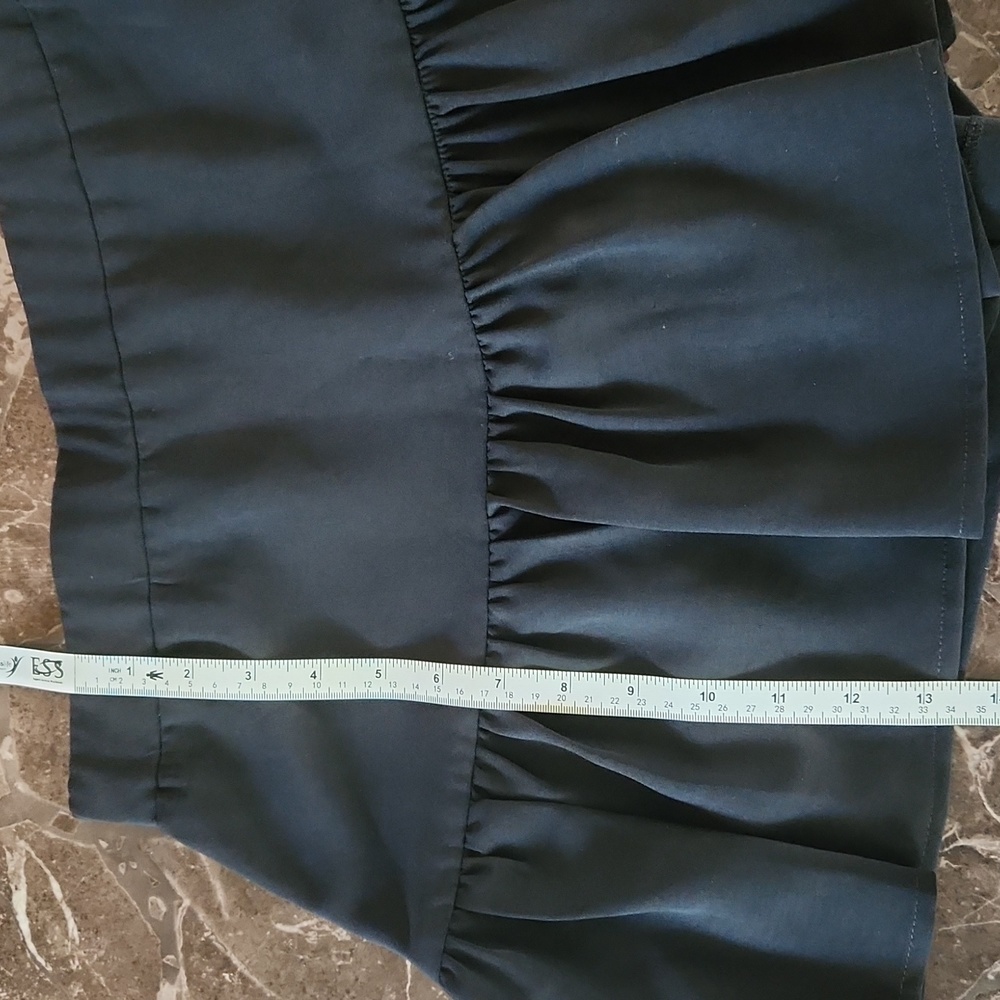 Cute black mini skirt by Impeccable Pig. Zips up the side, great condition! - Picture 8 of 9